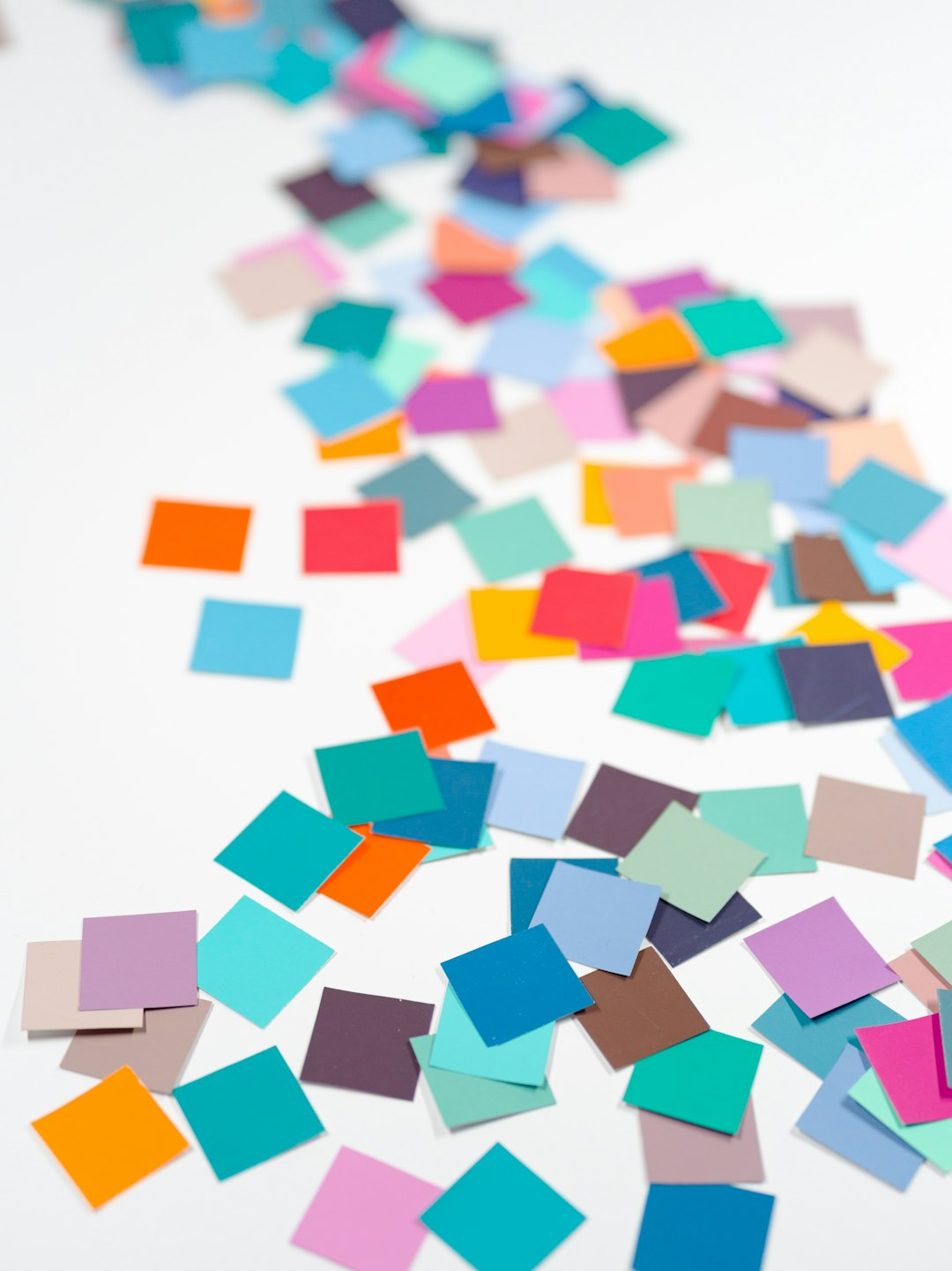 The Art of Drawing Readers In: Your attractive post title goes here Macro confetti... squares of colorful paper... white background